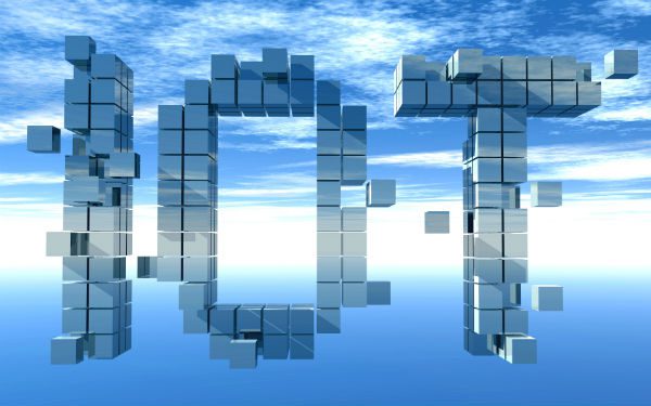Blue sky with "IOT" or internet of things made of square blocks in the background