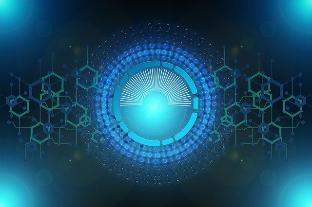 A glowing blue circular digital interface with radiating lines, geometric patterns, and hexagonal shapes, representing advanced technology or cybersecurity on a dark background.
