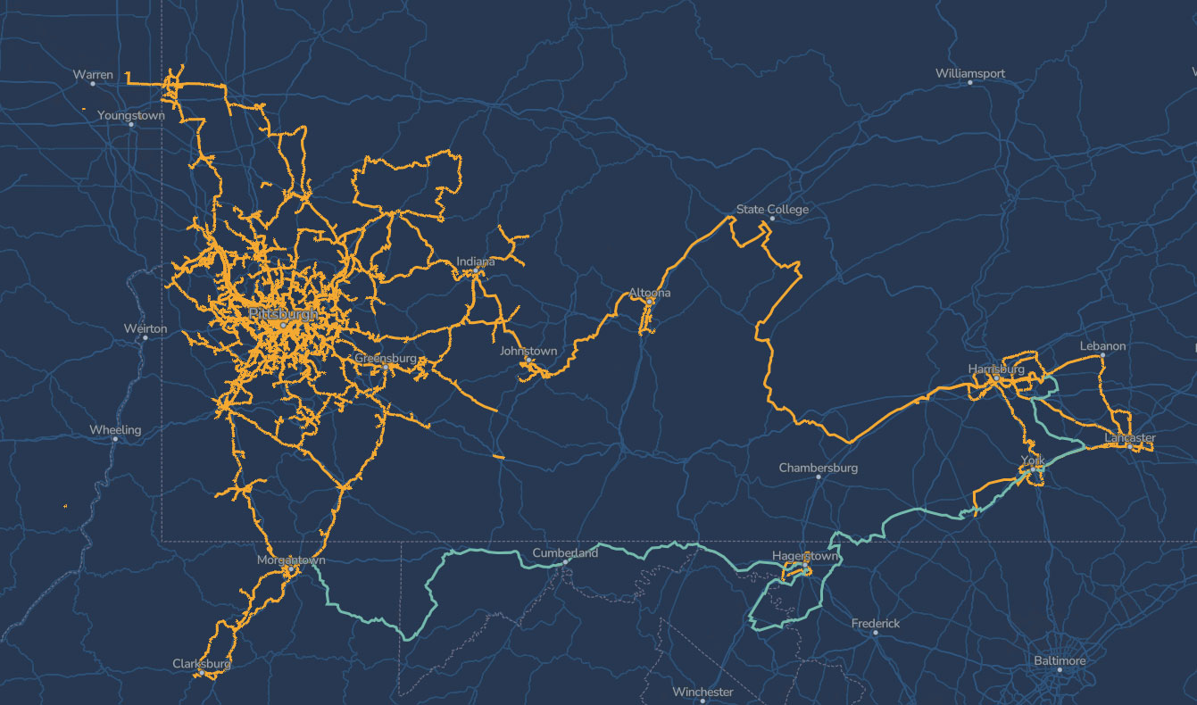A dark blue map shows a network of yellow lines winding through western and central Pennsylvania, with a light blue line running east-west near the southern border, marking major infrastructure routes.